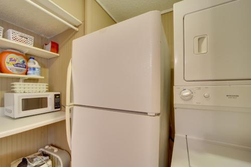 a white refrigerator in a kitchen with a microwave at Secluded Vian Retreat Close to Tenkiller Lake in Vian