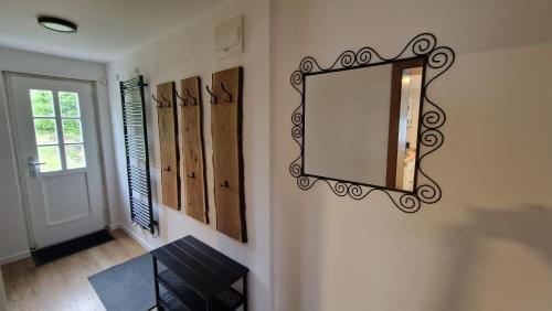 a mirror on the wall of a hallway at Relax chata Helena Mikulášovice - Tschechische und Sächsische Schweiz in der Nähe in Mikulášovice
