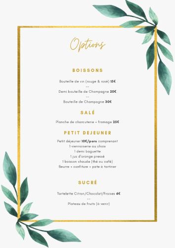 a wedding invitation with a gold border and green leaves at La Parenthèse Maisonnette avec Jacuzzi in Le Luc