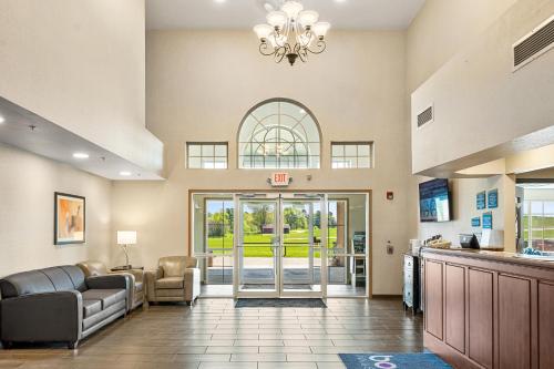 a lobby of a hospital with a door open at Boarders Inn & Suites by Cobblestone Hotels - Shawano in Shawano