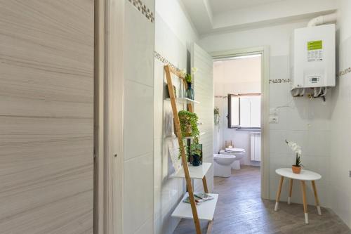 a small bathroom with a toilet and a staircase at Residenza Avezzano Bed and Breakfast in Avezzano
