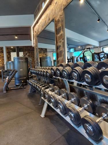 a row of dumbbells on display in a gym at Hotel Raices Esturion in Puerto Iguazú
