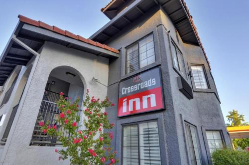 a building with a sign on the side of it at Crossroads Inn - Downtown Sacramento in Sacramento