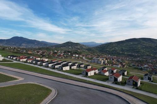 an aerial view of a village with houses and mountains at Poljine Hills in Poljine