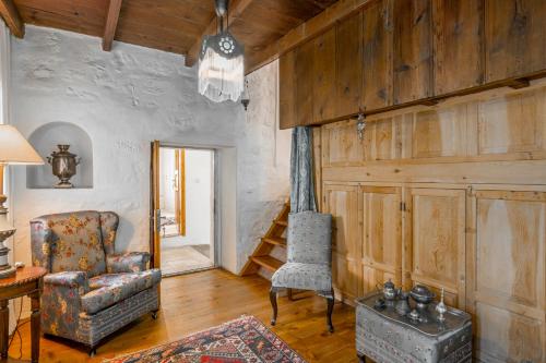 a living room with a chair and a table at Ha La Bodrum in Bodrum City