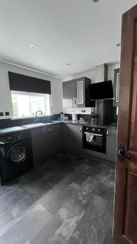a kitchen with a sink and a dishwasher at Florence house in Thornaby on Tees