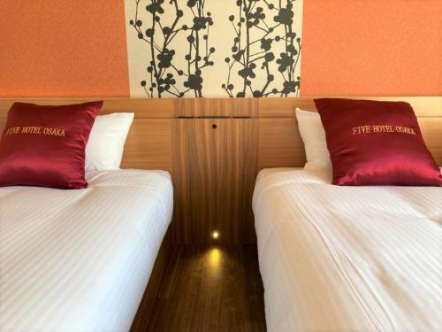 two beds sitting next to each other in a room at FIVE HOTEL OSAKA - Vacation STAY 52836v in Osaka