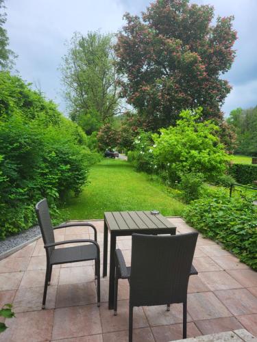 a patio with a table and chairs on a patio at Haus an der Werbe (studio) in Waldeck