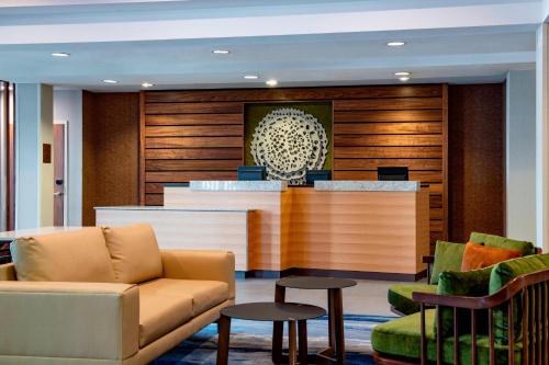 a lobby with a waiting area with a couch and chairs at Fairfield Inn & Suites by Marriott Kelowna in Kelowna