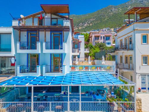 a view of a building with a swimming pool at Pazar Apartments in Kalkan