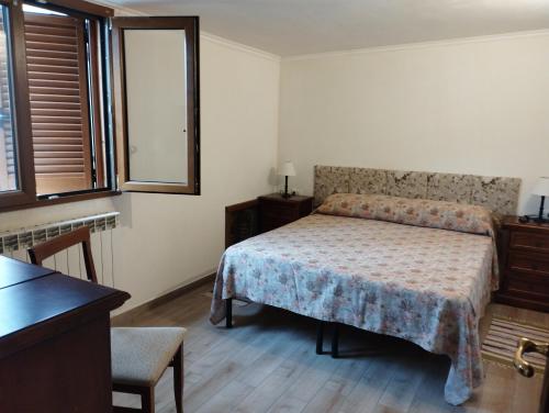 Säng eller sängar i ett rum på Appartamento Amatrice
