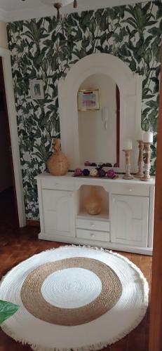 a room with a mirror and a dressing table with a table at As Mariñas 92 in Boiro