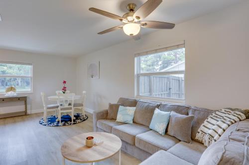 a living room with a couch and a ceiling fan at Jupiter Townhome with Patio and Yard about 6 Mi to Beach! in Jupiter