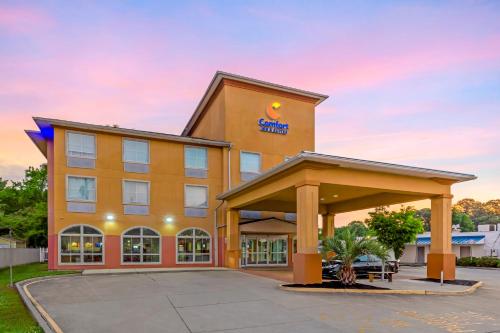 a hotel building with a sign on it at Comfort Inn & Suites Chesapeake - Portsmouth in Chesapeake