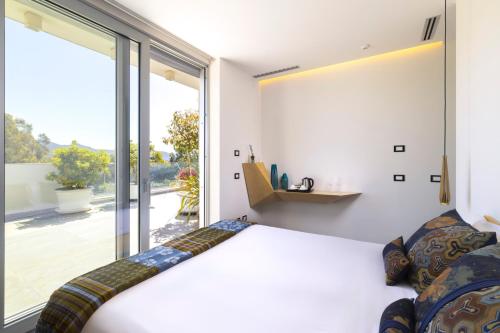 Ένα ή περισσότερα κρεβάτια σε δωμάτιο στο Villa Vi