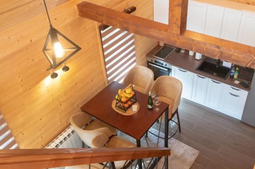 an overhead view of a kitchen with a table and chairs at Tara Vista Cabin in Zaovine