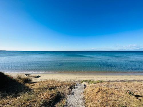 a view of the ocean from the beach at Sea front Villa Myrat in Epanomi