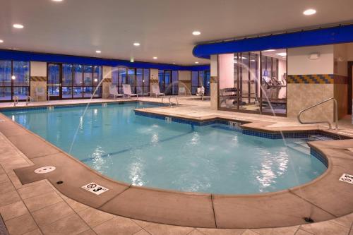 a large swimming pool in a hotel room at SpringHill Suites Coeur d'Alene in Coeur d'Alene