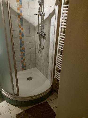 a bathroom with a shower with a shower at Residence Spillenberg Classic Room in Levoča