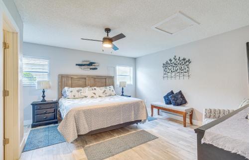 a bedroom with a bed and a ceiling fan at Crystal River Getaway with Dock, Kayaks and Bicycles! in Crystal River