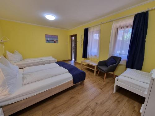 Postel nebo postele na pokoji v ubytování Muskátlis Ház