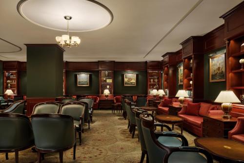 a waiting room with chairs and tables at Nagoya Marriott Associa Hotel in Nagoya