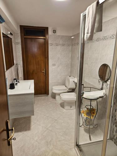 a bathroom with a toilet and a sink and a shower at Belforte House with terrace in Vernazza