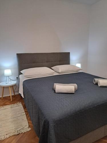 Postel nebo postele na pokoji v ubytování Apartmani Lukas