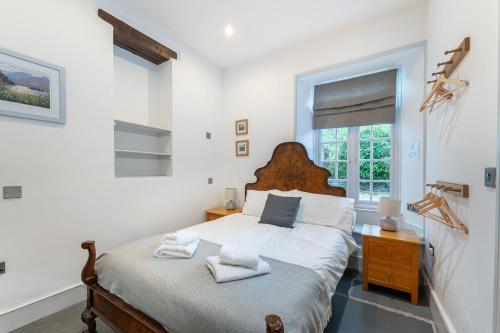 Postel nebo postele na pokoji v ubytování Riverside Cottage