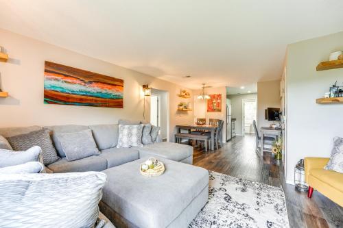 a living room with a couch and a table at Mtn-View Gem with Hot Tub Access Branson Condo in Branson