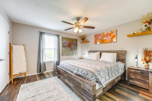 a bedroom with a bed and a ceiling fan at Mtn-View Gem with Hot Tub Access Branson Condo in Branson