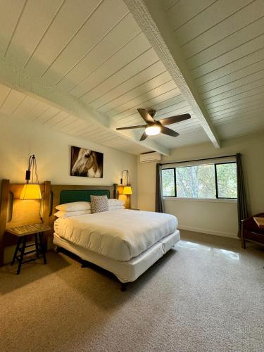 a bedroom with a bed and a ceiling fan at Hidden Valley Inn in Carmel Valley