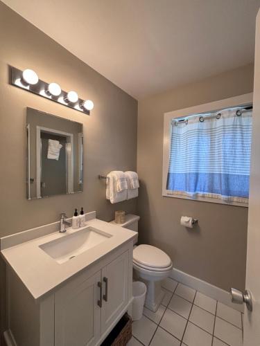 a bathroom with a sink and a toilet at Hidden Valley Inn in Carmel Valley
