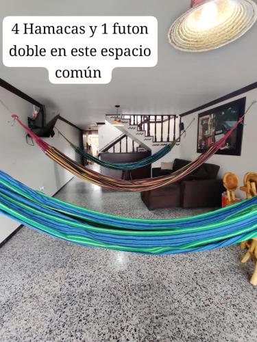 a hammock in the middle of a living room at Hotel - La Perla Del Caribe in Ríohacha