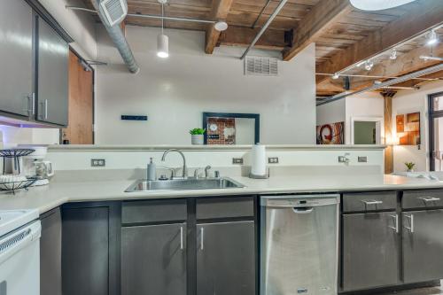 a kitchen with stainless steel cabinets and a sink at Downtown Dallas Condo - 2BR 1BA in Dallas