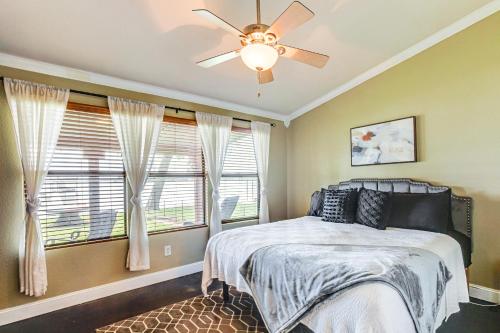 a bedroom with a bed and a ceiling fan at Private Dock and Deck Eagle Mountain Lake Retreat! in Rhome