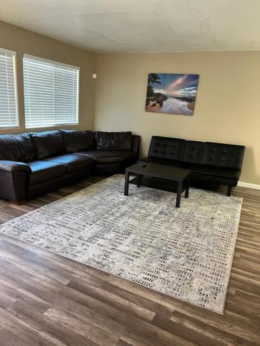 a living room with a couch and a coffee table at Quiet 1bed,1bath condo with free parking in Fresno