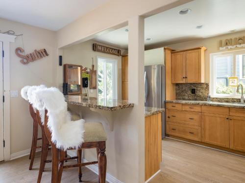 a kitchen with wooden cabinets and a counter top at El Segundo Beach 5B4b Home, POOL Hot Tub, BEACHES, Local Town! in El Segundo