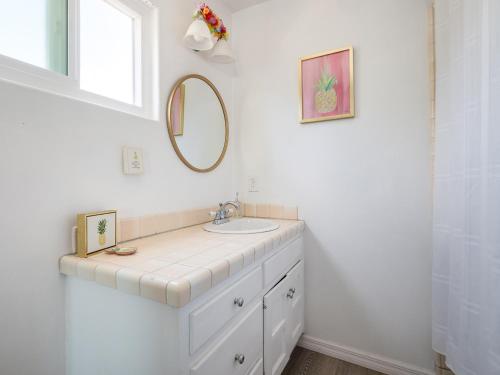 a white bathroom with a sink and a mirror at El Segundo Beach 5B4b Home, POOL Hot Tub, BEACHES, Local Town! in El Segundo