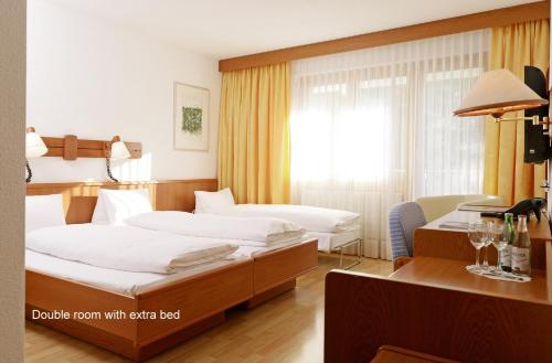 Łóżko lub łóżka w pokoju w obiekcie Hotel Meierhof Self-Check-In