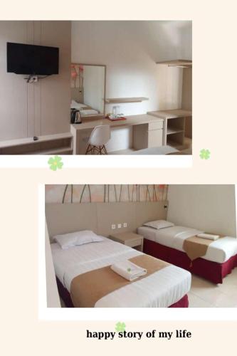 a bedroom with two beds and a happy story of my life at wisma sejahtera hotel in Magelang