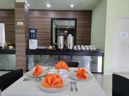 a table with two plates of food on it at wisma sejahtera hotel in Magelang