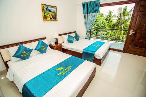 Postel nebo postele na pokoji v ubytování Thai Binh Cam Ranh Hotel
