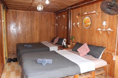 Letto o letti in una camera di Mộc Homestay Đảo Phú Quý