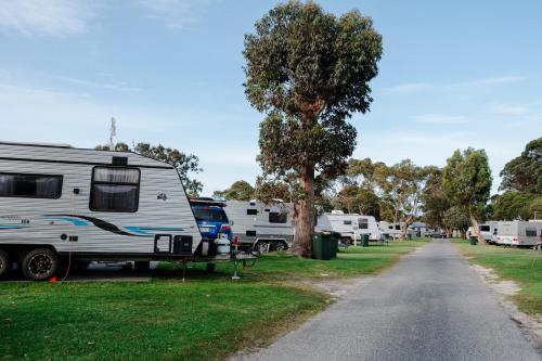 a group of rvs parked next to a road at Tasman Holiday Parks - Albany in Albany