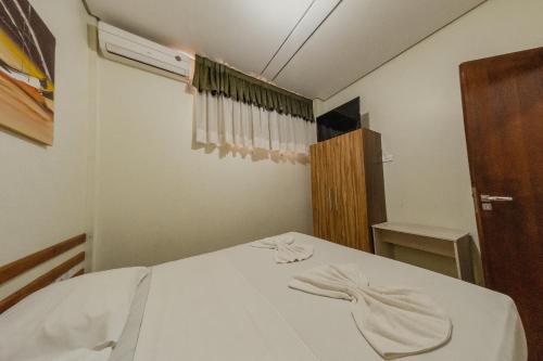 Postel nebo postele na pokoji v ubytování Pousada Iguassu Charm Suites