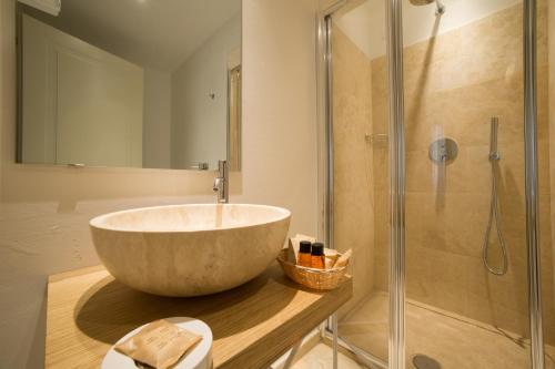 a bathroom with a large bowl sink and a shower at B&B Santa Maria del Fiore in Florence