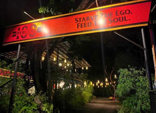 a sign that says save the ego feed the soul at Cafe Moto Hostel in Puerto Princesa City