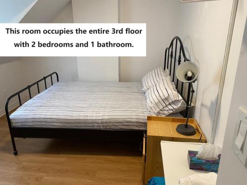 a small bedroom with a bed in a room at Quad Room with Private Bathroom 536A-Two Bedrooms in Toronto