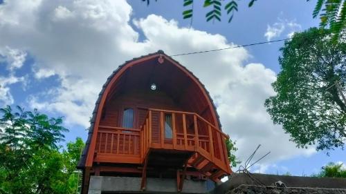 a tree house on top of a building at Albizia Chalet in Negara